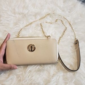 Creme Wallet with shoulder strap and wrist strap Used some marks on the front